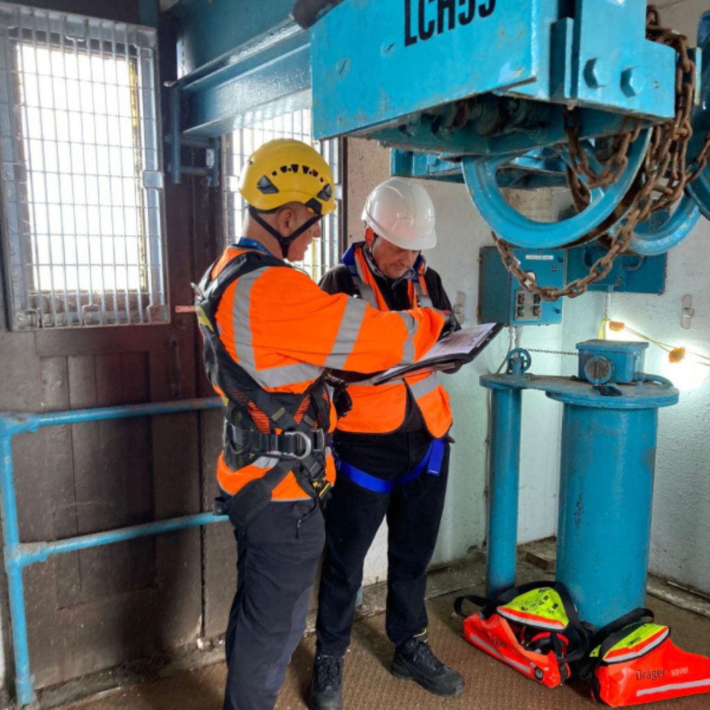 Troy reviewing a rescue plan with another team member.