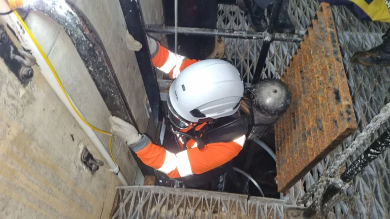 worker entering a confined space