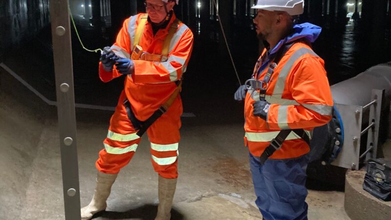 Two members of rope access team checking ropes