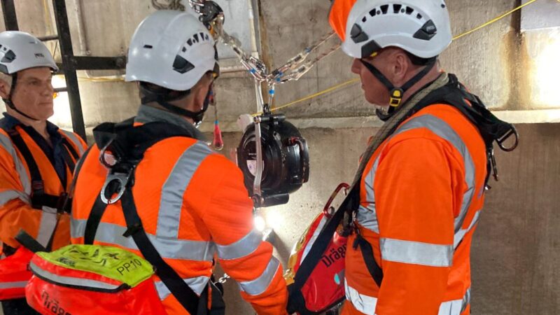 Three rescue team member reviewing rescue plans