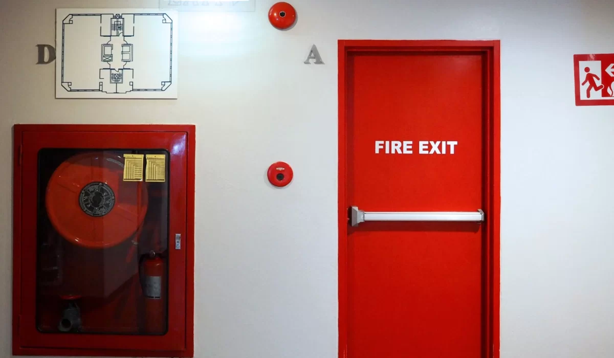 Fire door with a fire extinguisher on the left side and a map