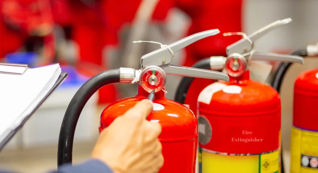 A fire safety expert checking the fire extinguishers in an establishment