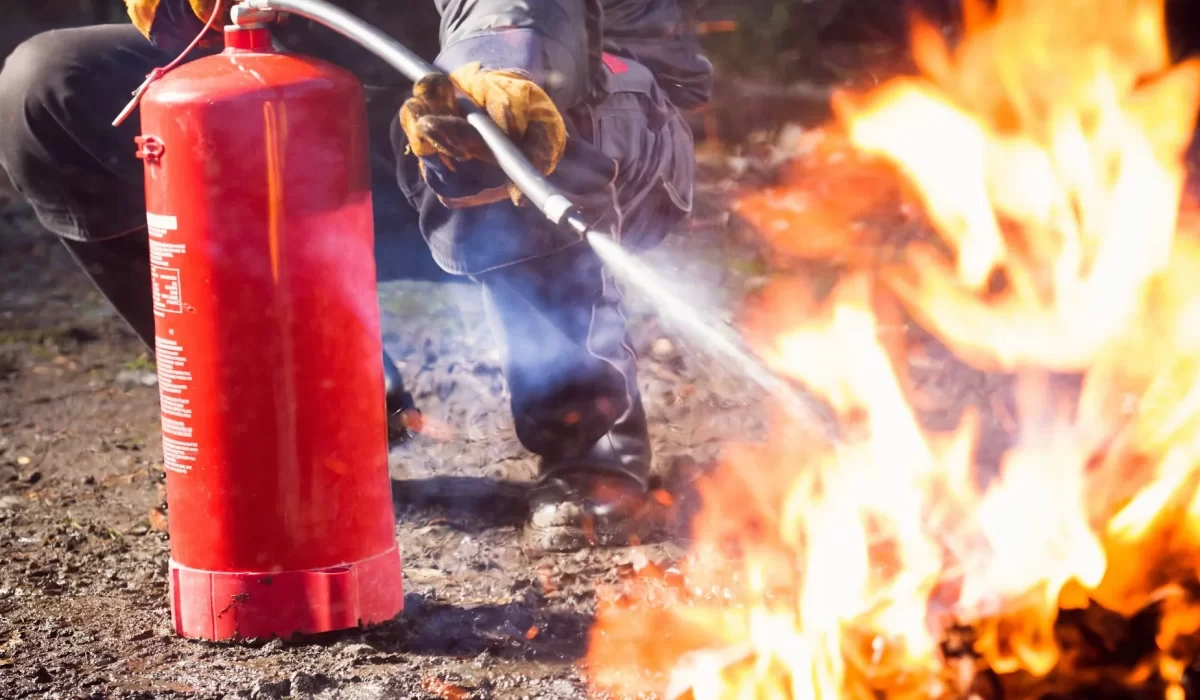 Fire safety expert providing a fire extinguisher application procedure.