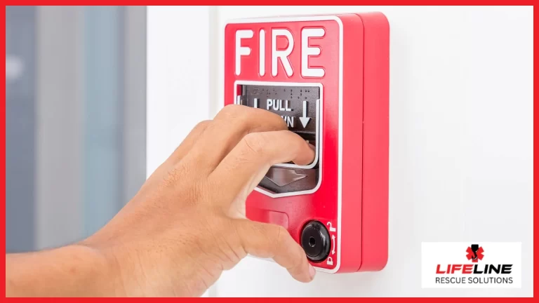 A hand pulling the fire alarm